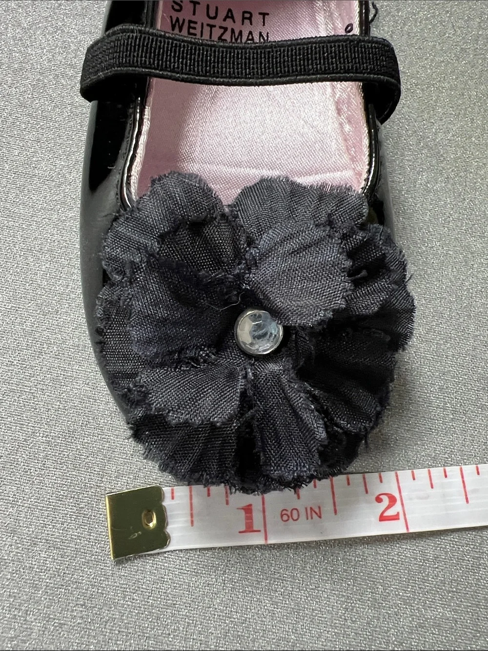 Stuart Weitzman Black Patent Mary Jane Shoes with Flower Accent